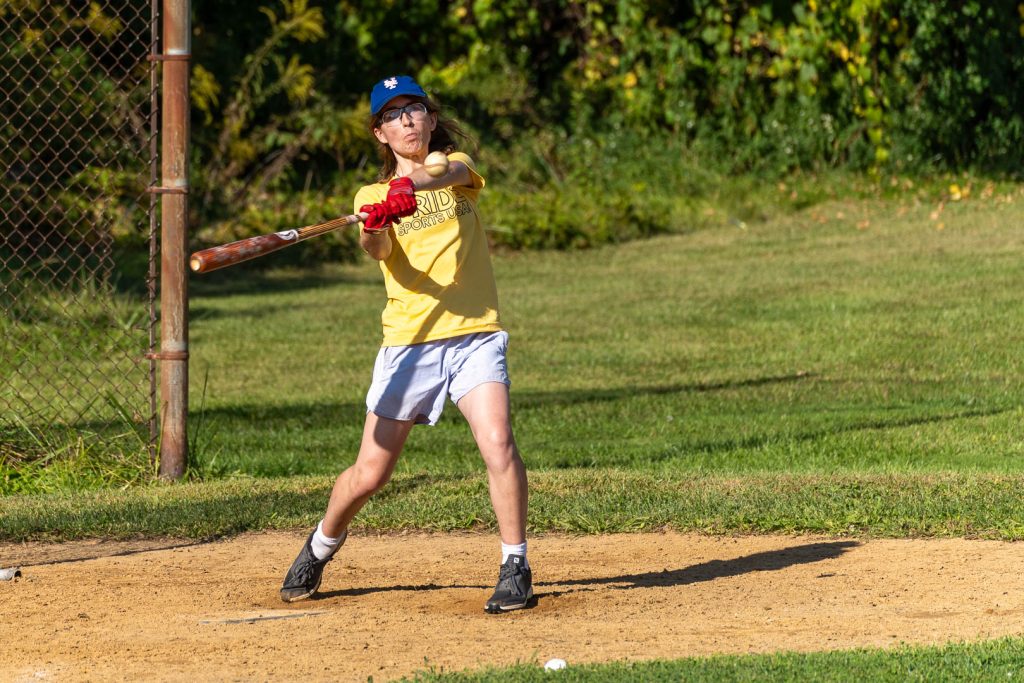 Rand, swinging the bat while focused on a baseball during the 2024 Albany Riverfront Rangers Home Run Derby.